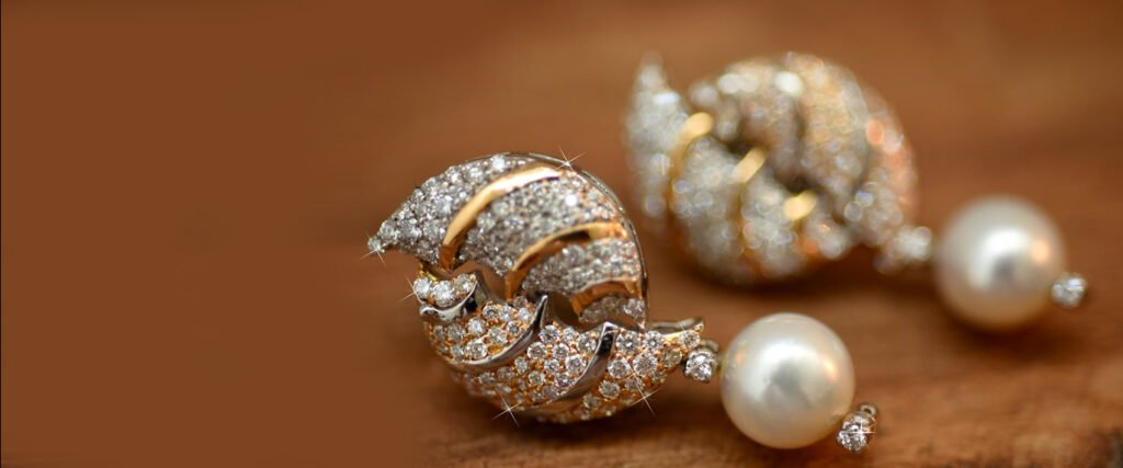 Luxurious diamond-encrusted earrings with a swirling, shell-like design.